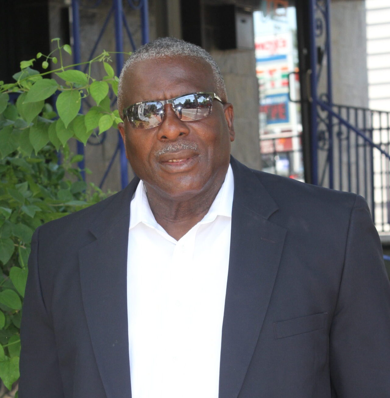 man in front of a bush - Selwyn Holder partner of Storm Associates